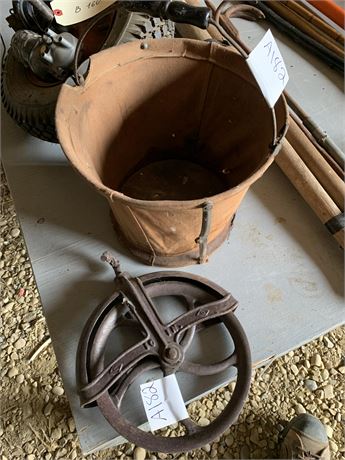 Lot 182 - Vintage canvas water buckets and Pulley Wheel Cast Iron